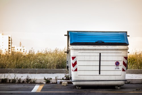 Commercial waste collection vehicle at a depot